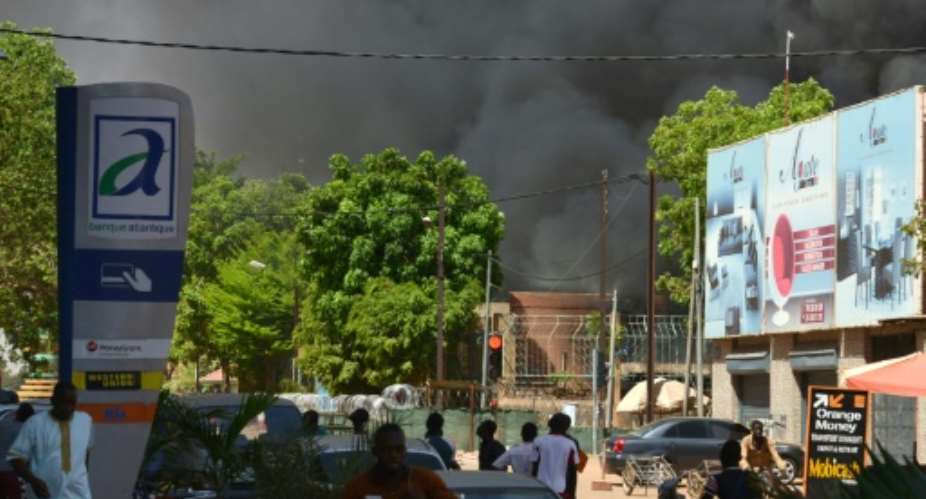 Thick smoke rose from the centre of Ouagadougou as the attacks unfolded.  By Ahmed OUOBA AFP