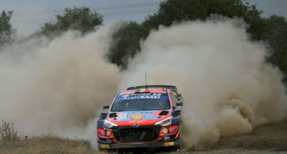 Thierry Neuville steered his way through the stormy conditions to retain his Safari Rally lead as he chases a first season win.  By TONY KARUMBA AFP