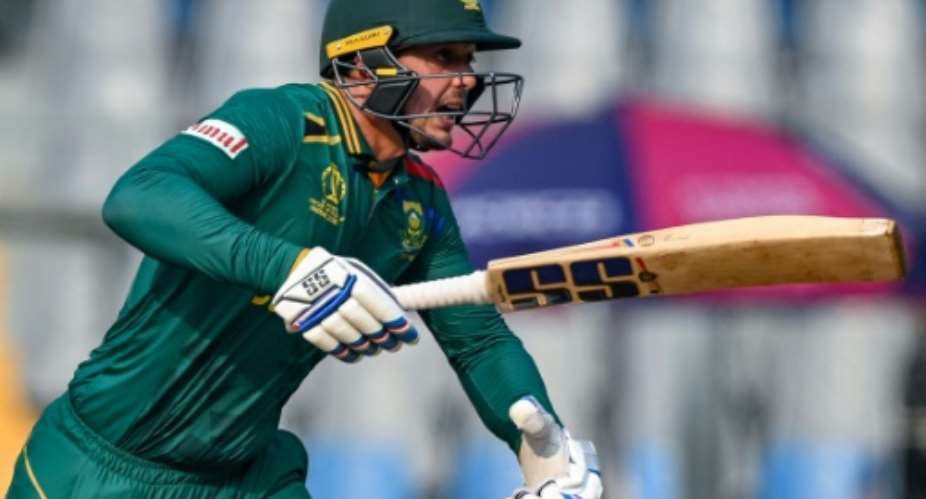 Third century: South Africa's Quinton de Kock on his way to another hundred in the World Cup match against Bangladesh in Mumbai on Tuesday.  By INDRANIL MUKHERJEE AFP