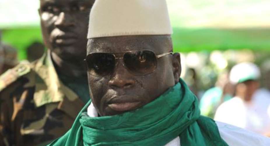 Gambian President Yahya Jammeh greets supporters during a rally in Bakau on November 22, 2011.  By Seyllou AFPFile