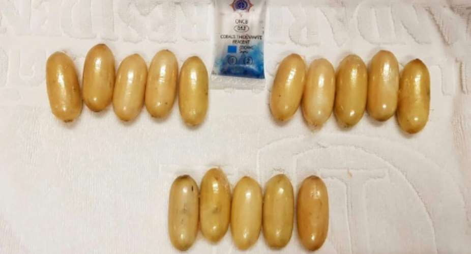 This handout from Thailand's Office of the Narcotics Control Board shows capsules of cocaine found in the possession of Kenyan national Glenn Chibasellow Ooko at Suvarnabhumi airport in Bangkok.  By Handout OFFICE OF THE NARCOTICS CONTROL BOARDAFP
