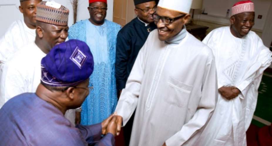 This handout photograph taken and released by the Nigerian government last month shows President Muhammadu Buhari 2R receiving visitors in London where he has been undergoing treatment for an undisclosed illness for more than three months..  By BAYO OMOBORIOWO NIGERIA STATE HOUSEAFP