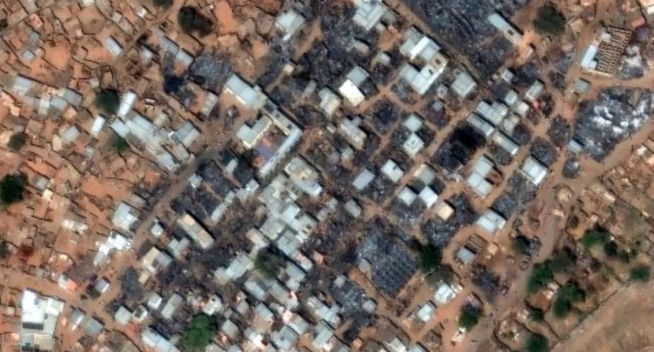 This handout satellite image taken by Maxar Technologies on February 13, 2025 shows heavy damage at the entrance to the Zamzam camp near North Darfurs besieged capital of El-Fasher.  By - (Satellite image 2024 Maxar Technologies/AFP/File)