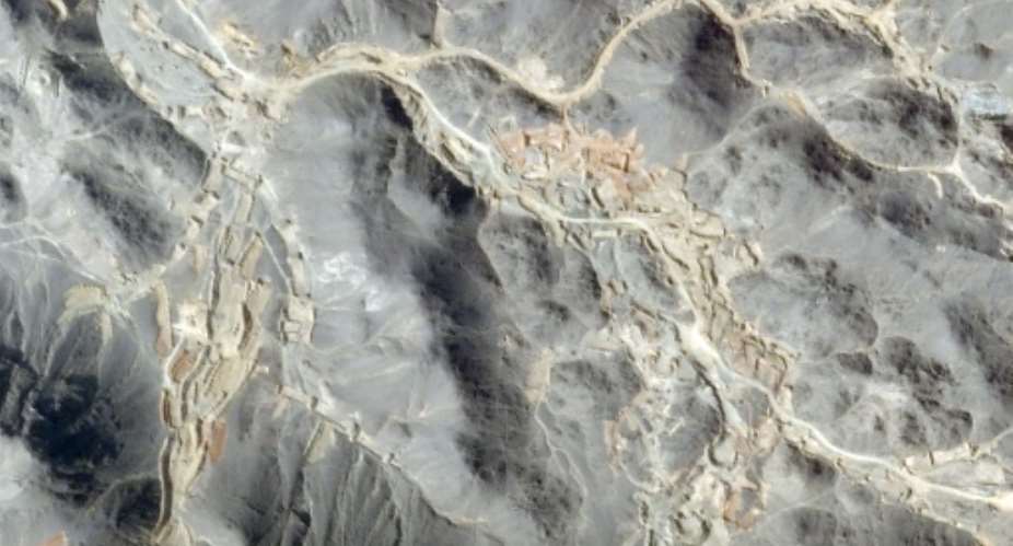 This handout satellite image taken by Planet Labs PBC on October 13, 2026 and provided on October 21, 2026, and analysed by AFP, shows a general view of excavation sites and earthworks at the location of artisanal gold mines in Jabal al-Uqaydat.  By - (2026 Planet Labs PBC/AFP)