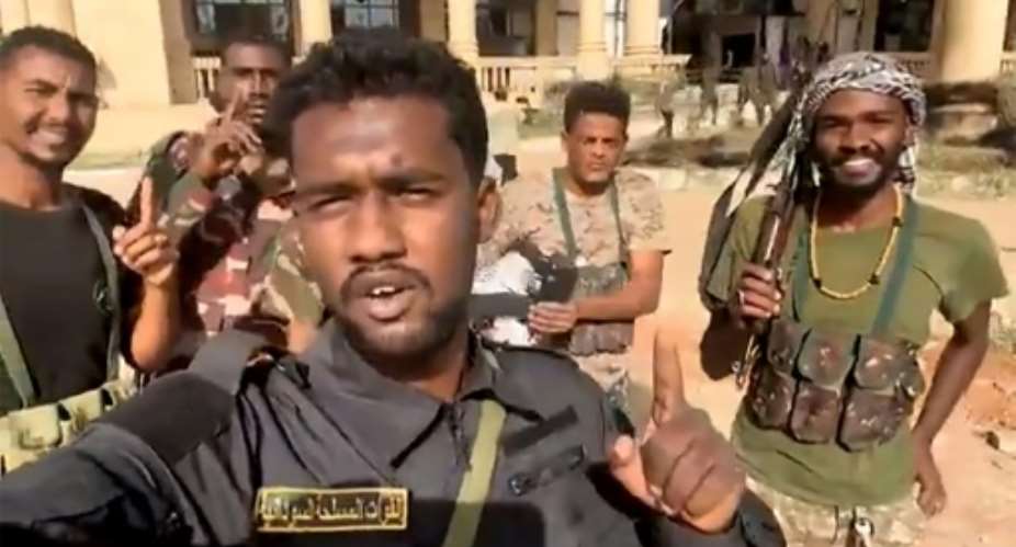 This image grab from social media video shows Sudanese volunteers celebrating the regular armys recapture of the presidential palace in Khartoum..  By  (UGC/AFP)