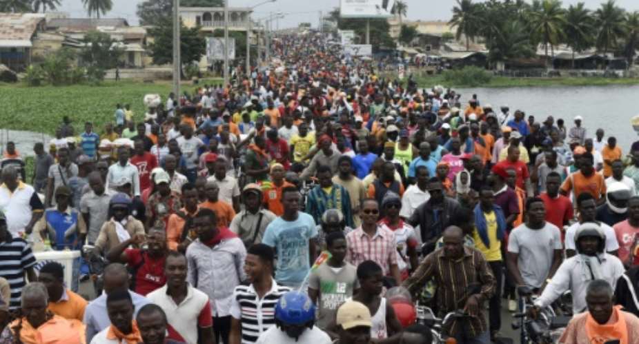 This photo taken on September 7, 2017 shows protesters marching during an anti-government demonstration led by a coalition of opposition parties on in Lome.  By PIUS UTOMI EKPEI AFPFile