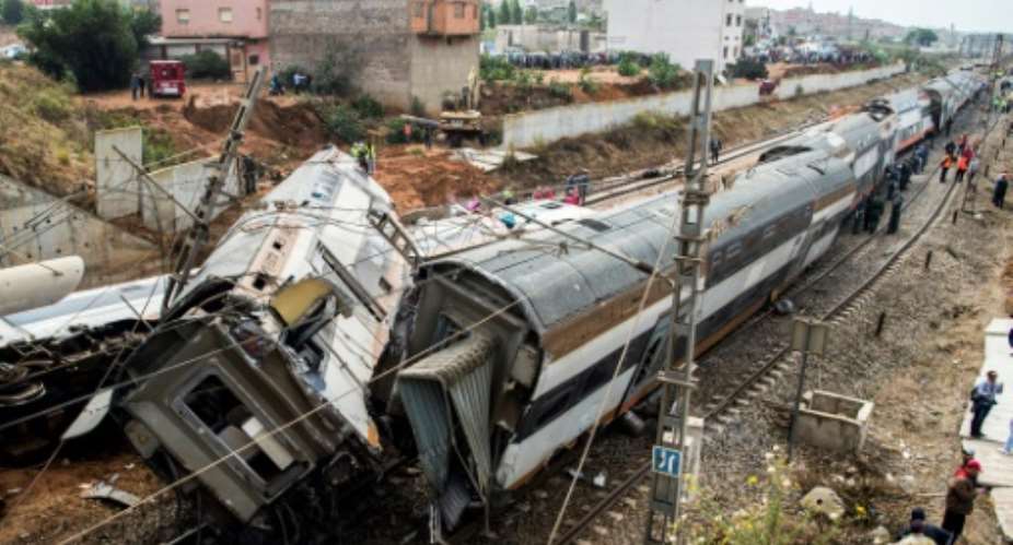 This picture taken on October 16, 2018 shows the scene of a rail accident in the Moroccan town of Bouknadel, between the capital Rabat and the port city of Kenitra to its north.  By FADEL SENNA AFP