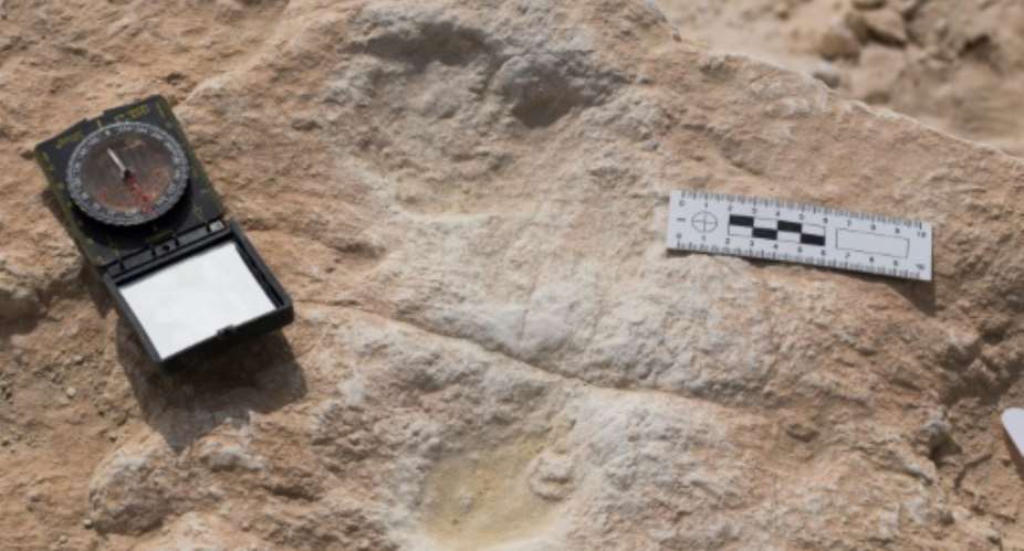 This undated handout photo obtained September 16, 2020 shows the first human footprint discovered at the Alathar ancient lake.  By Klint Janulis Klint JANULISAFP