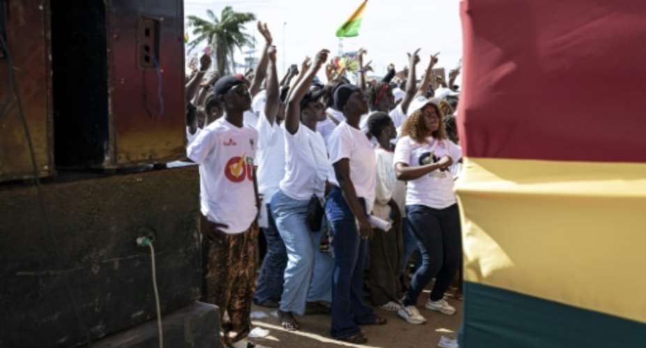 Those in favour of a yes vote in Guineas constitutional referendum dance and sing during at an event at Conakrys Palace of the People event space, on September 18, 2025.  By PATRICK MEINHARDT (AFP)