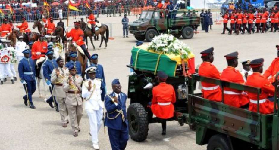A military cortege conveyed John Atta Mills' body from the State House to Independence Square for the funeral.  By Pius Utomi Ekpei AFP