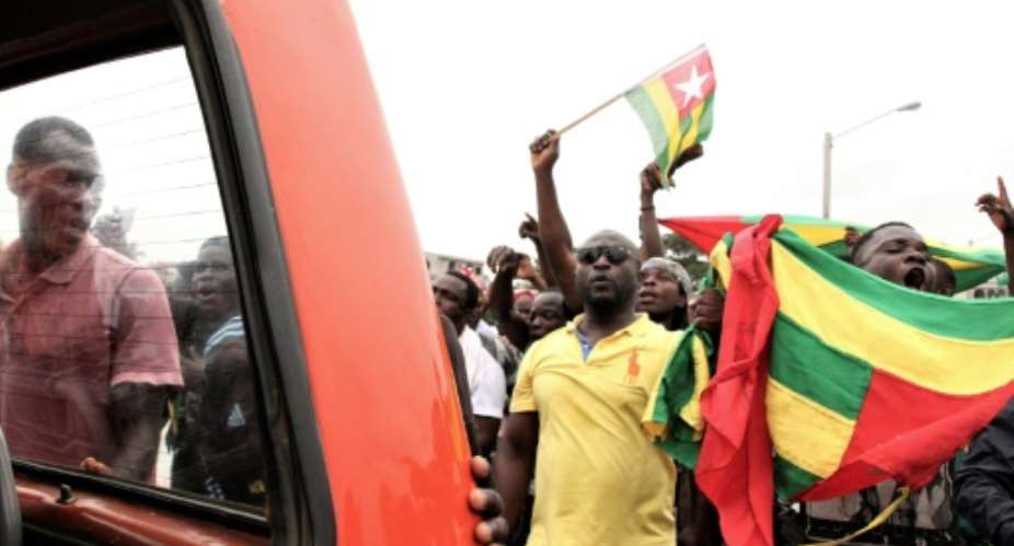 Thousands have continued to march in the streets of Togos capital Lome to force out President Faure Gnassingbe, in power since the death of his father in 2005.  By Matteo FRASCHINI KOFFI (AFP)