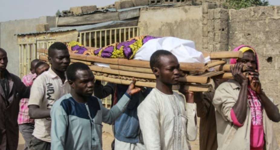 Thousands of people have died since Boko Haram launched its insurgency in 2009. On Tuesday, villagers at Sajeri, near the northeastern Nigerian city of Maiduguri, laid to rest one of three people killed in a jihadist attack.  By Audu MARTE AFP