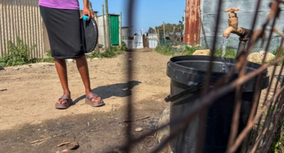 Thousands of people in Cape Town lack proper access to water and power.  By RODGER BOSCH (AFP)