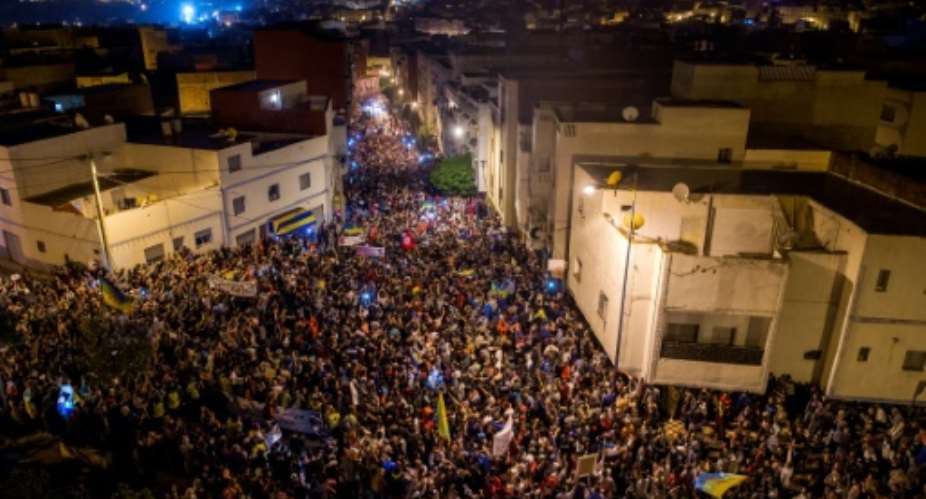 Thousands of protestors crowd the steets of the northern Moroccan city of Al-Hoceima during a demonstration of the grassroots Al-Hirak al-Shaabi Movement on May 31, 2017.  By FADEL SENNA AFP