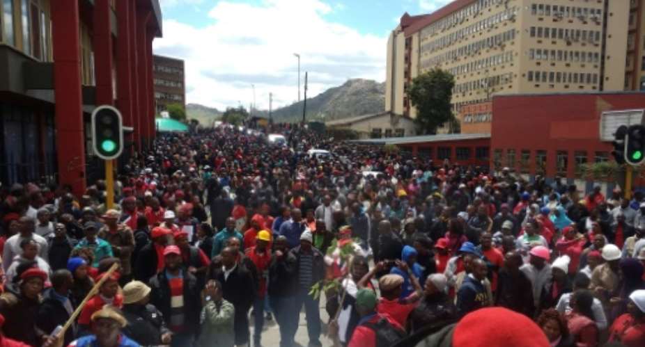 Thousands of Public Servants and teachers march through the streets of Mbabane.  By MONGI ZULU AFP
