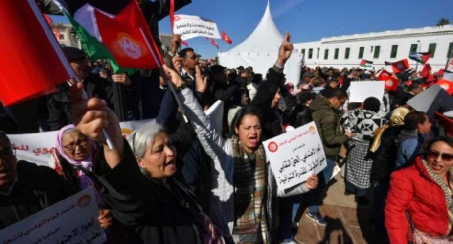 Thousands of trade unionists protest outside the prime minister's office in Tunis against deteriorating living standards in Tunisia.  By FETHI BELAID AFP