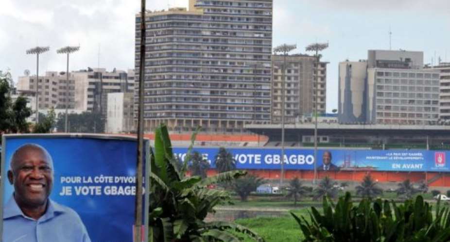 A giant campaign poster for President Laurent Gbagbo in Abidjan.  By Issouf Sanogo AFPFile