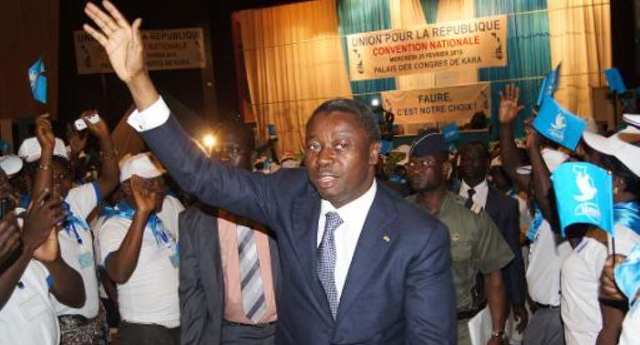 Togo's President Faure Gnassingbe waves to supporters during the Union for the Republic's national gathering in Kara on February 25, 2015.  By Emile Kouton AFPFile