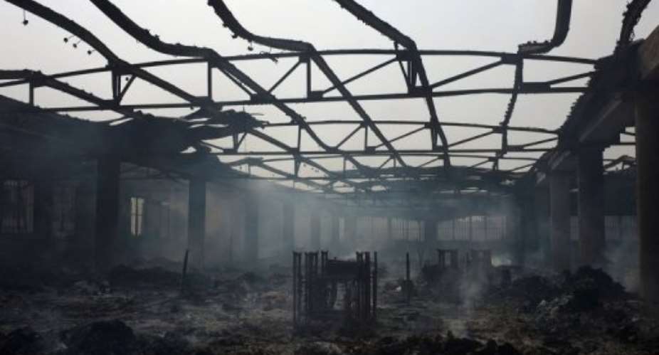 The steel frames of sewing machines are seen Lome's Grand Marche on January 12, 2013 after it was engulfed in flames.  By Daniel Hayduk AFPFile