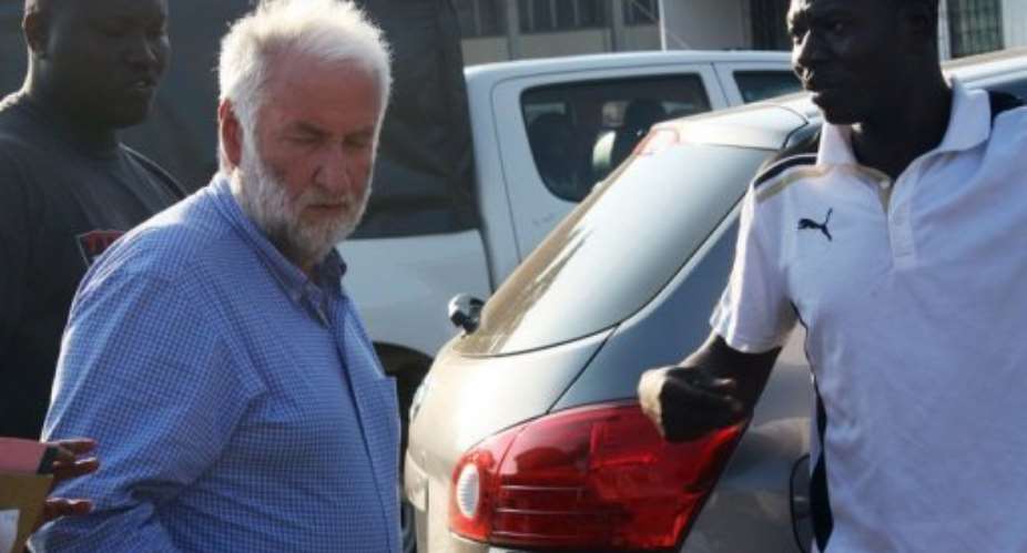 Loik Le Floch-Prigent (L) arrives at a Togolese court in Lome on September 17, 2012, to be questioned.  By Emile Kouton (AFP/File)
