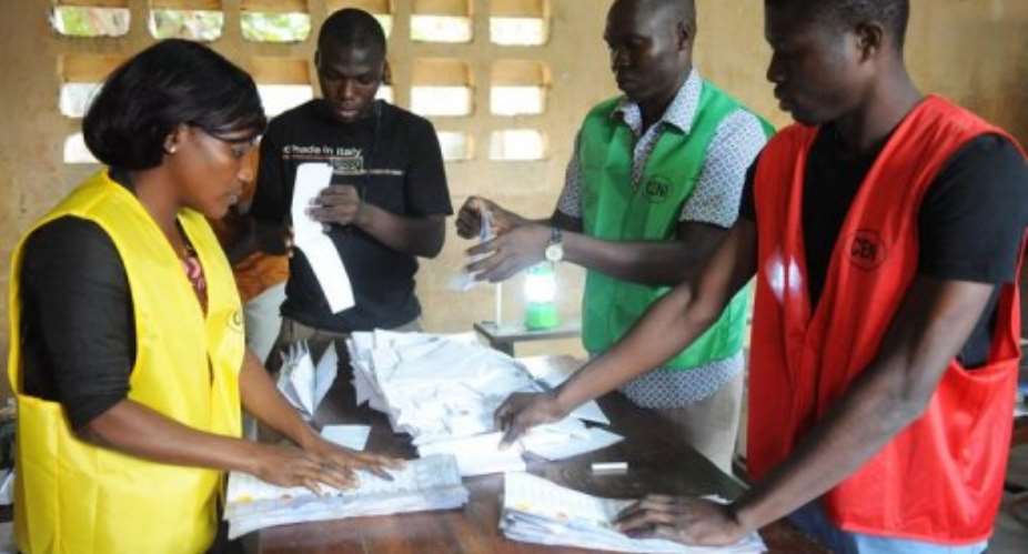 Members of Togo's Independent National Electoral Commission sort out valid votes on July 25, 2013 in Lome.  By Pius Utomi Ekpei AFPFile