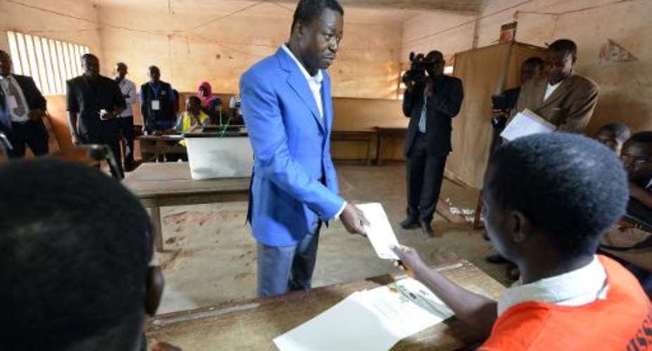 Togo's incumbent President Faure Gnassingbe prepares to vote in the presidential election at a polling station in Lome on April 25, 2015.  By Issouf Sanogo AFP