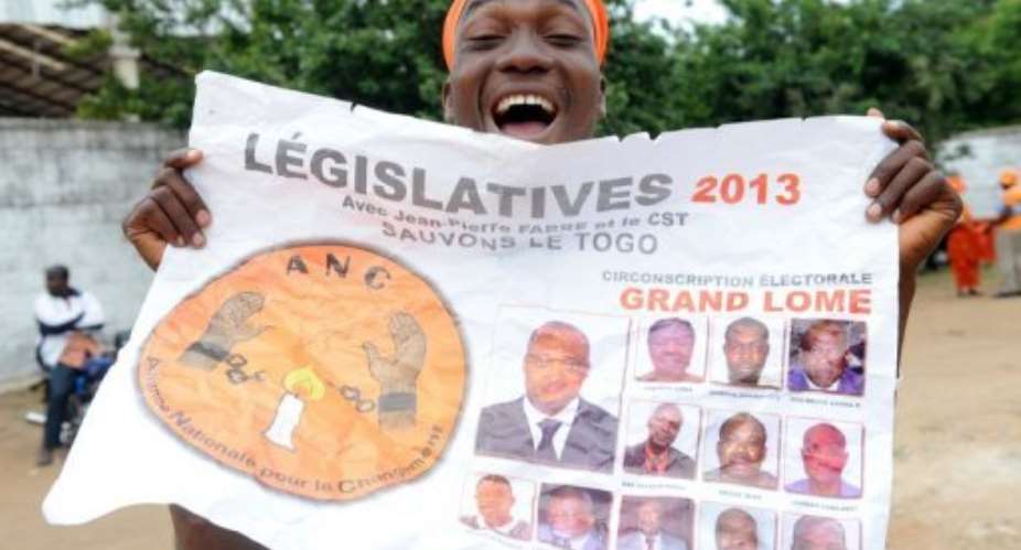 A supporter of opposition leader Jean-Pierre Fabre, of Collective Save Togo CST, rallies in Lome on July 23, 2013..  By Pius Utomi Ekpei AFP