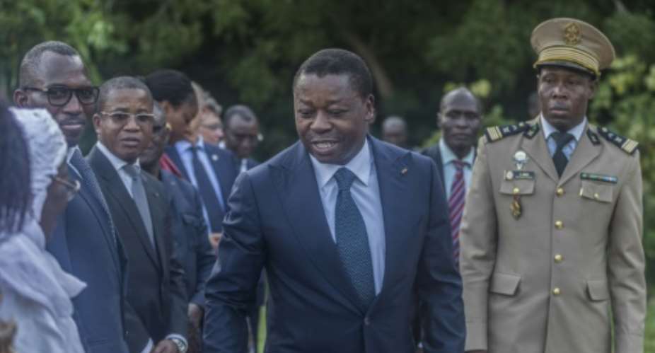 Togolese President Faure Gnassingbe C looks set to win another term this year.  By Yanick Folly AFP