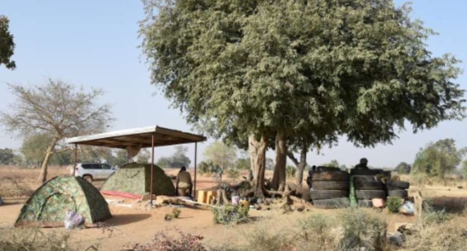 Togolese soldiers at the border with Burkina Faso, from where jihadist groups cross over into the small west African country.  By PIUS UTOMI EKPEI (AFP)