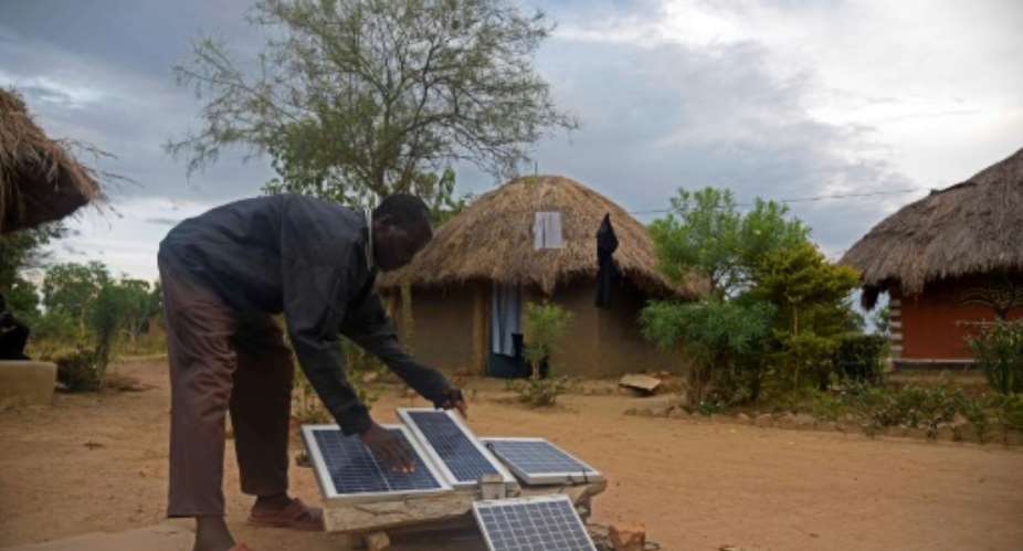 Togo's ambitious electrification strategy will see major investment in solar energy, including the use of individual solar panel kits for remote households like these being used in Uganda.  By ISAAC KASAMANI AFPFile