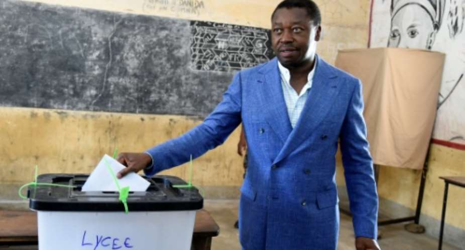 Togo's long-time leader, Faure Gnassingbe, casting his vote in presidential elections in February.  By PIUS UTOMI EKPEI AFP