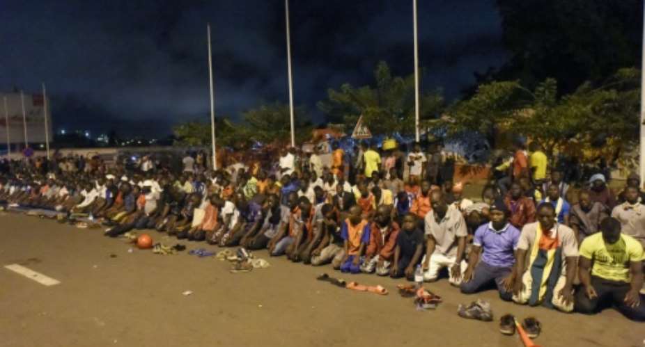 Togo's opposition supporters, seen here praying at an all-night vigil, are putting huge pressure on the government to enact constitutional reform.  By PIUS UTOMI EKPEI AFPFile