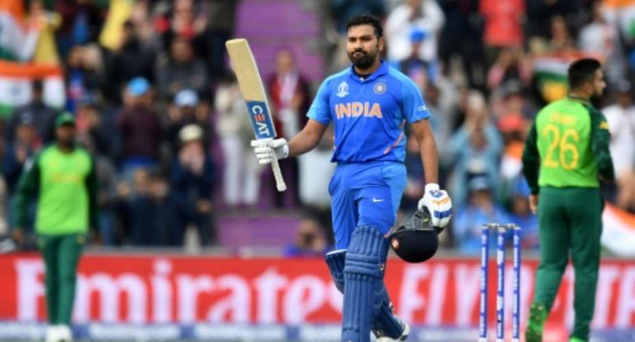Ton-up -- Rohit Sharma celebrates reaching his century during India's six-wicket World Cup win over South Africa.  By Dibyangshu SARKAR AFP