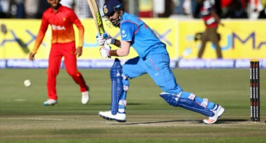 India batsman KL Rahul hits a ball during the first one-day international ODI matches between India and host Zimbabwe at the Harare Sports Club in Harare on June 11, 2016.  By Jekesai Njikizana AFP