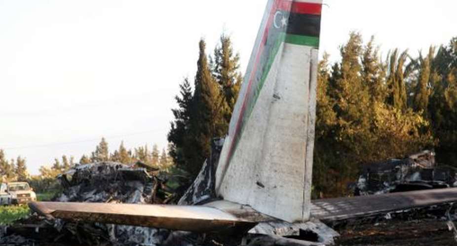 A picture taken on February 21, 2014 shows the wreckage of a Libyan army medical plane that crashed in the Grombalia area, south of the Tunisian capital, Tunis, killing all 11 people on board.  By Mohamed Fliss (AFP)