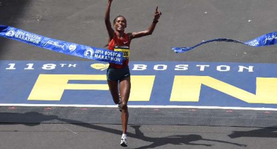 Rita Jeptoo of Kenya crosses the finish line to win the Women's Elite division of the 118th Boston Marathon in Boston, Massachusetts on April 21, 2014.  By Timothy A. Clary AFPFile