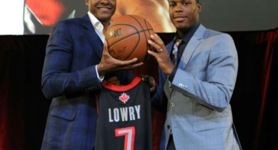 Toronto Raptors president Masai Ujiri, at left alongside Raptors star Kyle Lowry, went from a boyhood in Nigeria to making decisions that could bring the NBA title to Toronto.  By Ron Turenne NBAE  Getty ImagesAFPFile