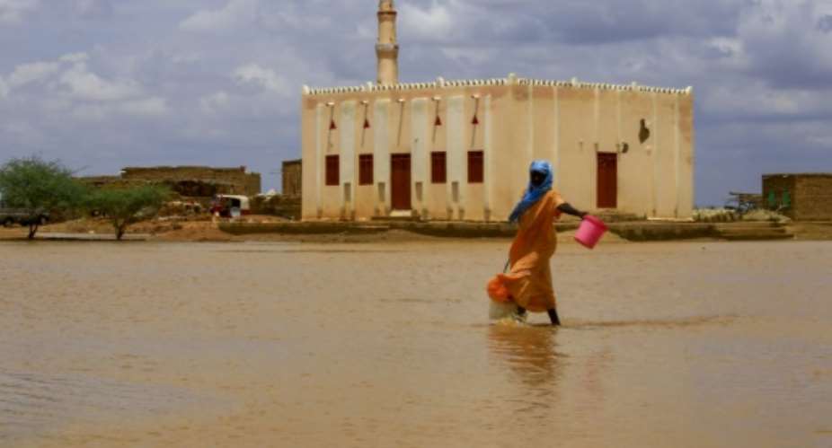 Torrential rains and flooded have battered Sudan this week leaving at least 30 people dead.  By ASHRAF SHAZLY AFPFile