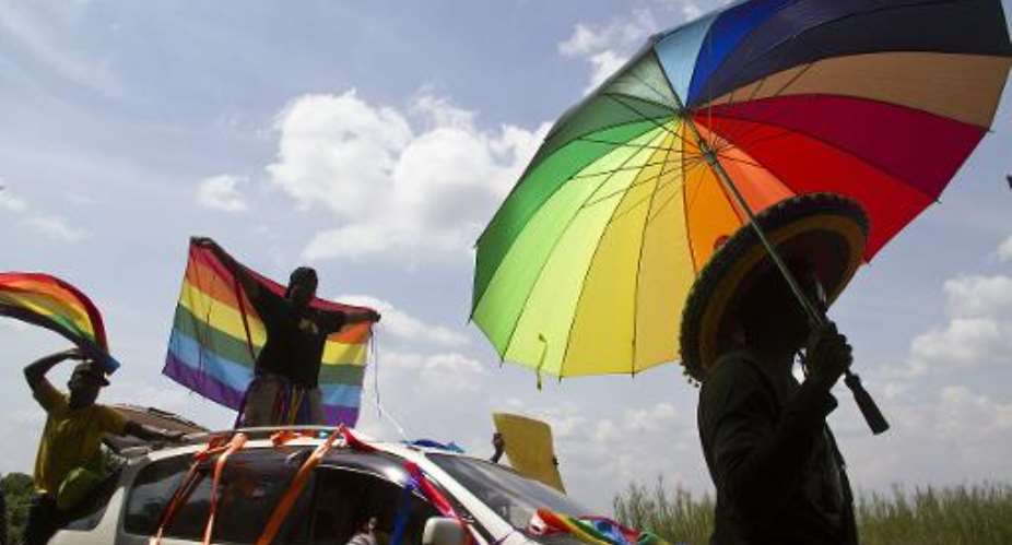 Ugandan activists take part on August 9, 2014 in the first gay-pride march in Entebbe since an anti-gay law was overturned.  By Isaac Kasamani AFPFile
