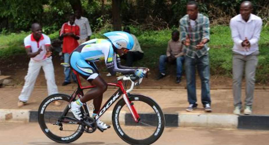 A Rwandan cyclist competes in the first stage of the Tour of Rwanda in Kigali on November 17, 2014.  By Stephanie Aglietti AFPFile