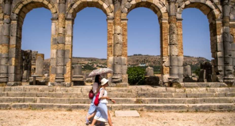 Tourists walk through the ruins of the ancient Roman site of Volubilis, near the Moroccan city of Meknes.  By FADEL SENNA AFPFile