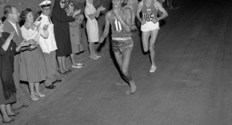 Ethiopian athlete Abebe Bikila was the first black African to win Olympic gold with a now-iconic, barefoot victory in the marathon at the 1960 games in Rome.  By  EPUAFPFile