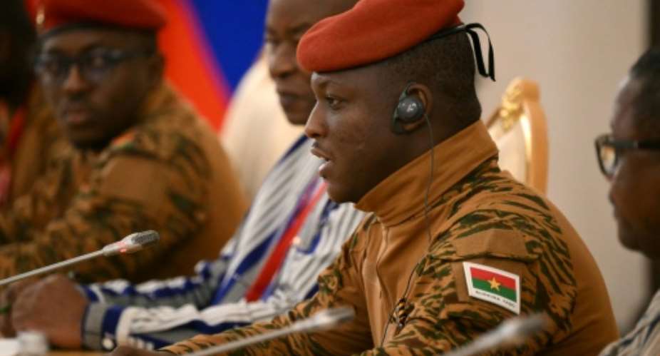 Traore (R) threatened anyone who dared to challenge his rule, saying: Ill take you down..  By Angelos Tzortzinis (AFP)