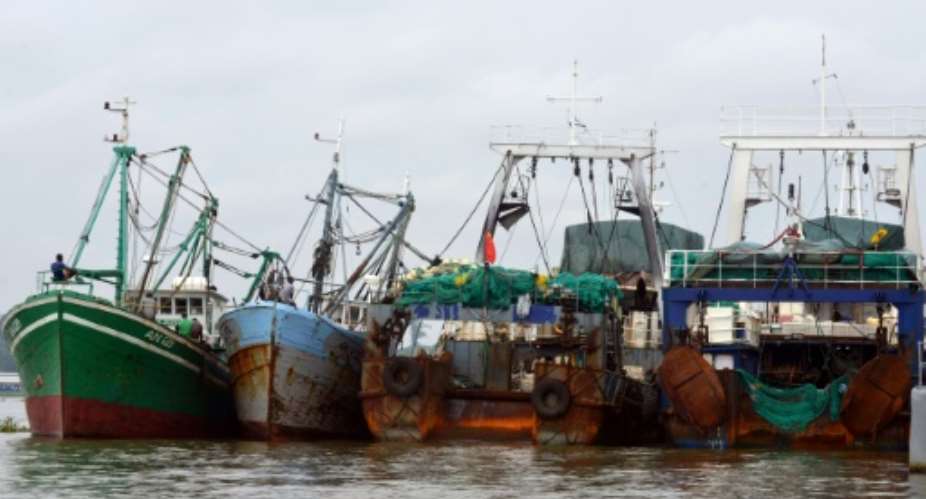 Trawlers seen docked in Abidjan, Ivory Coast's economic capital, during a crackdown on illegal fishing in 2014.  By ISSOUF SANOGO AFP