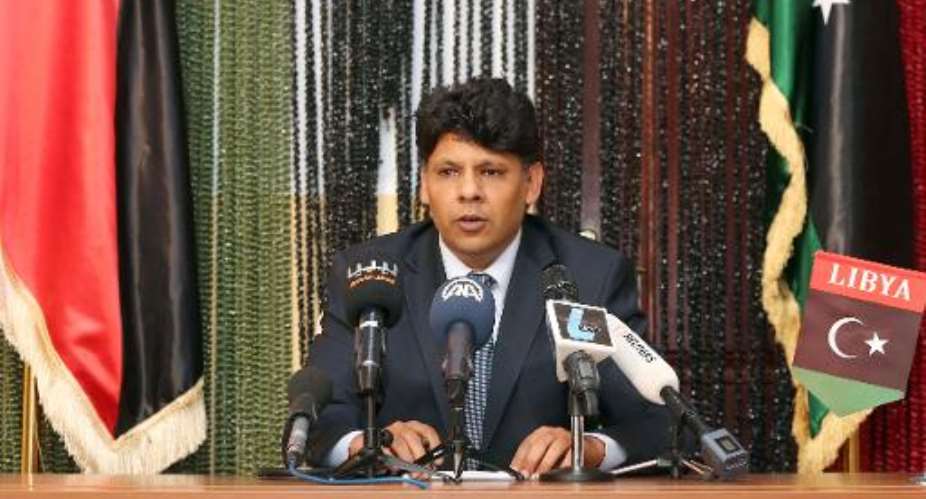 Seddik al-Sour, spokesman for the Libya state prosecutor's office, speaks during a press conference on March 24, 2014, in Tripoli.  By Mahmud Turkia AFP