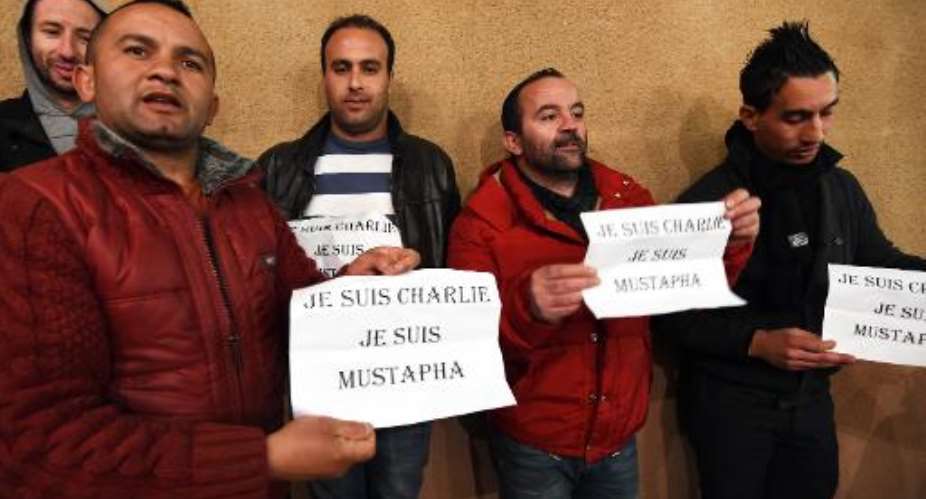 Algerians attend a memorial gathering on January 15, 2015 for Charlie Hebdos proof reader Mustapha Ourrad, who was killed in the Paris attacks.  By Farouk Batiche (AFP)