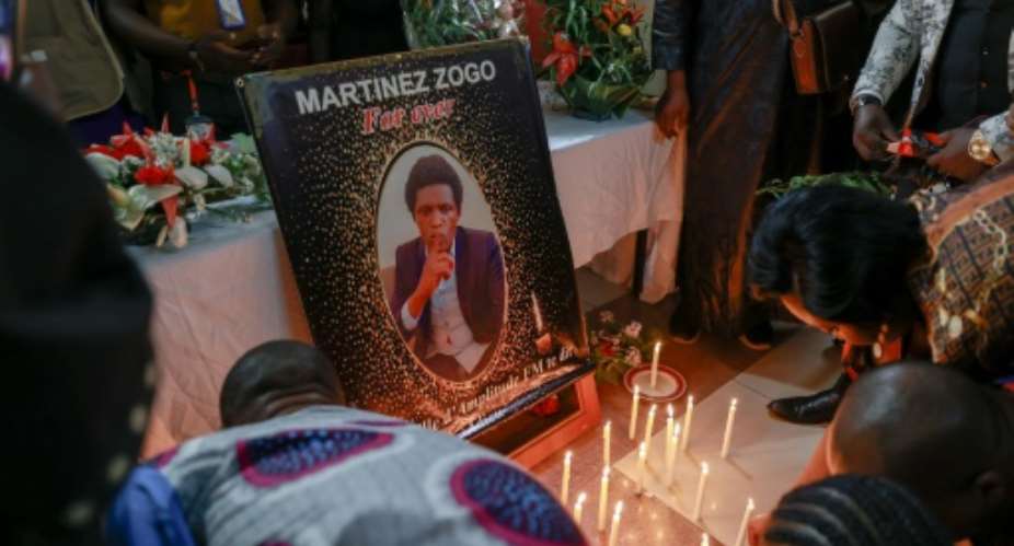 Tributes to radio journalist Martinez Zogo, who was murdered in a high-profile case that has rocked Cameroon.  By Daniel Beloumou Olomo AFP