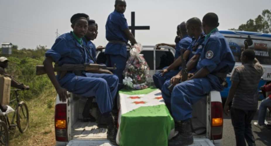 Police carry the coffin of a policeman shot on the eve of Burundi's presidential elections, to a cemetery on the outskirts of Bujumbura on July 23, 2015.  By Phil Moore AFP