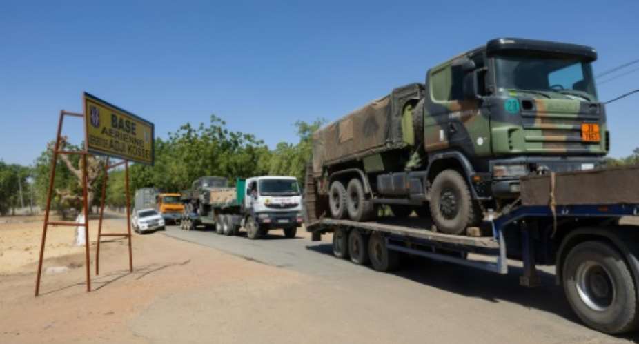 Trucks carrying French army vehicles and equipment leaving the Kossei base.  By Joris Bolomey (AFP)