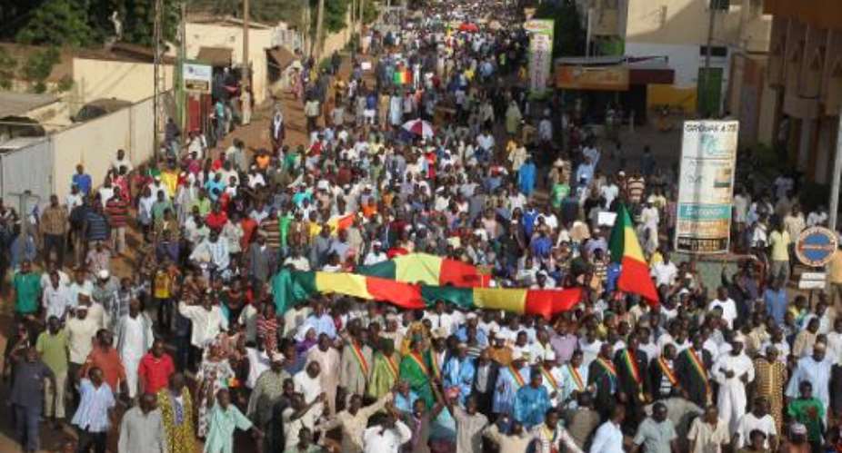 Thousands of people participate in a march September 25, 2014, in Bamako, Mali, demanding peace and to protest calls for independence in the north by Touareg rebels.  By Habibou Kouyate AFPFile